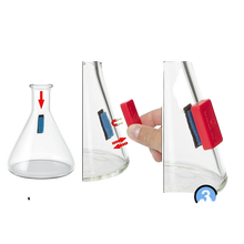 Load image into Gallery viewer, A Snowtree BoroBuddy Mini Magnetic Glass Pipe Cleaner cleaning a glass water pipe.