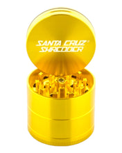 Load image into Gallery viewer, Santa Cruz Shredder 4-Piece Medium Gold Metal Grinder with lid removed.
