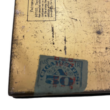 Load image into Gallery viewer, The bottom of a Lucky Strike Toasted Cigarette Tin