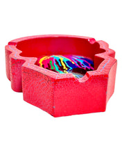 Load image into Gallery viewer, The bottom side of a Rainbow Skull Poly Stone Skull Ashtray.