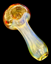 Load image into Gallery viewer, An amber Fumed Chunky Head Strung Spoon Pipe handblown by TKO Glassworks in the dark.