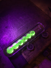 Load image into Gallery viewer, Three Handmade UV Reactive Pearl Sets under UV light.