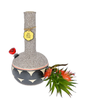 Load image into Gallery viewer, A Coyōté Bud Vase Bong with succulent topper and bottle-brush style artificual flower toker poker removed.
