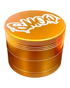 A gold 63mm Smoq 4-Part Ceramic Coated Grinder. 