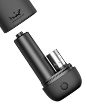 Load image into Gallery viewer, A black Cloak V2 Cartridge Battery &amp; Dab Pen with a wax coil inside.
