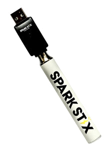 A white Spark Stix Variable Voltage Pen Battery.