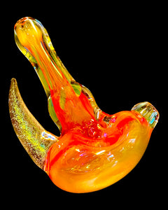 A TKO Glassowrks Fumed Dicro Horn Spoon Pipe in the dark.