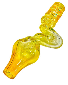 A yellow TKO Glassworks 4-Hole Squiggle Steamroller Pipe.