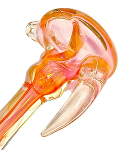 The head of a TKO Glassworks Fumed Dicro Horn Spoon Pipe.