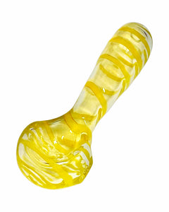 A yellow Kitchen Glass Designs Fumed Swirl Spoon Pipe. 
