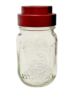 A pebble-colored GOAT Grinder AITH v.1 attached to a mason jar.