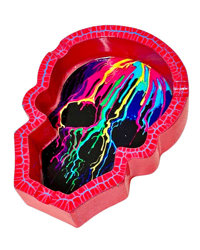 A Rainbow Skull Poly Stone Skull Ashtray.