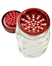 Load image into Gallery viewer, A pebble-colored GOAT Grinder AITH v.1 attached to a mason jar.
