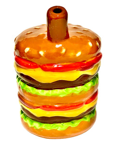 The mouthpiece of a Roast & Toast Cheeseburger Ceramic Hand Pipe.