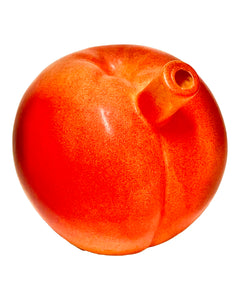 The mouthpiece of a Roast & Toast Ripe Peach Ceramic Hand Pipe.