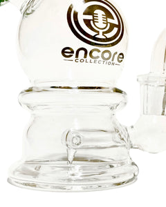 The base and popped hole perc of an Encore Igloo Dab Rig.
