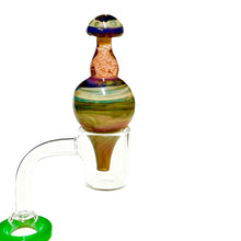 Load image into Gallery viewer, A swirl Homie G Mushroom Bubble Carb Cap in a dab nail.

