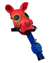 Load image into Gallery viewer, A pig mask Gas Mask Bong with a blue acrylic skull bong.
