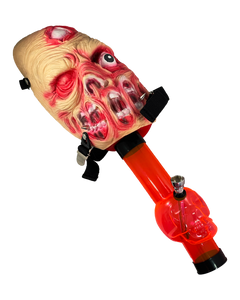 A Zombie Gas Mask Bong with a red acrylic skull bong.